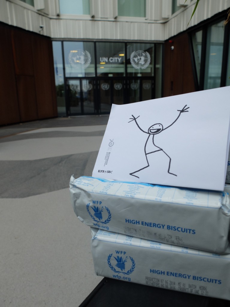 Elyx in front of the UN City waiting to taste the WFP high energy biscuits.